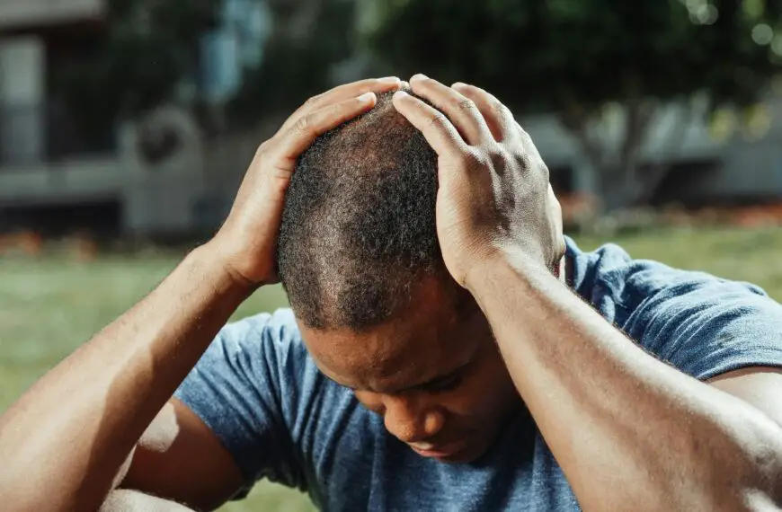 A man holding his head