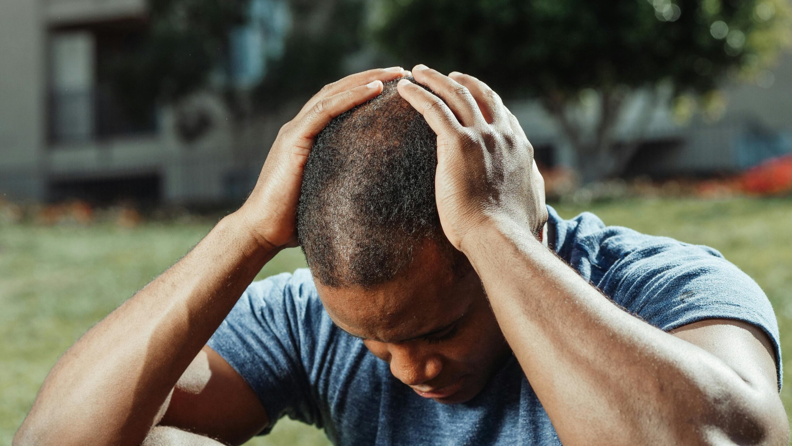 A man holding his head
